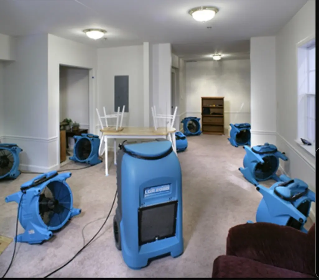 Air movers and dehumidifier setup for Water Damage Restoration in Center Line